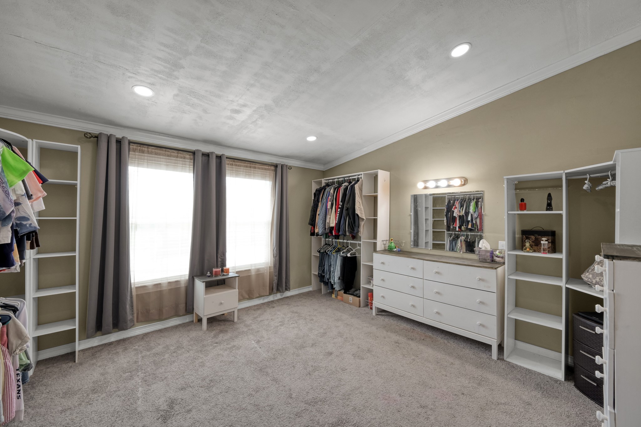 144 Wood Farm Road Huntsville, TX 77320 - Photo 14 of 35 a view of a bedroom with furniture and windows
