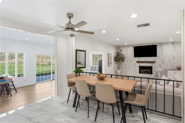 a view of a dining room with furniture window and outside view