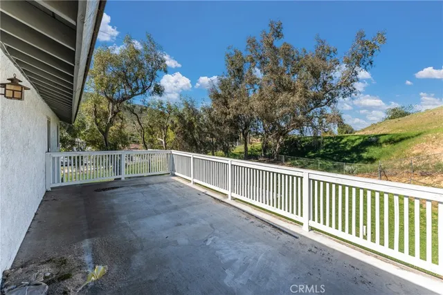 a view of a street view from a balcony