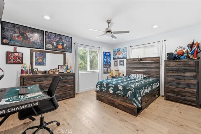 a bedroom with furniture and a window