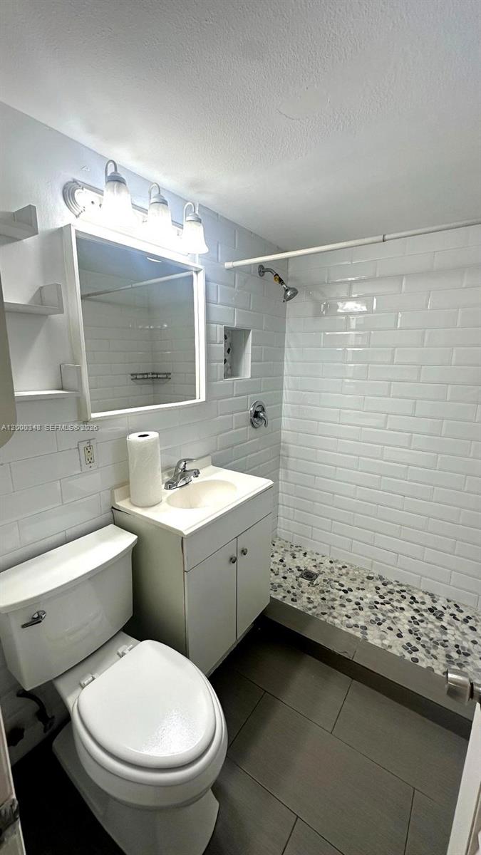 4444 Southwest 67th Avenue, Unit 6 Miami, FL 33155 - Photo 11 of 11 a bathroom with a sink toilet and shower