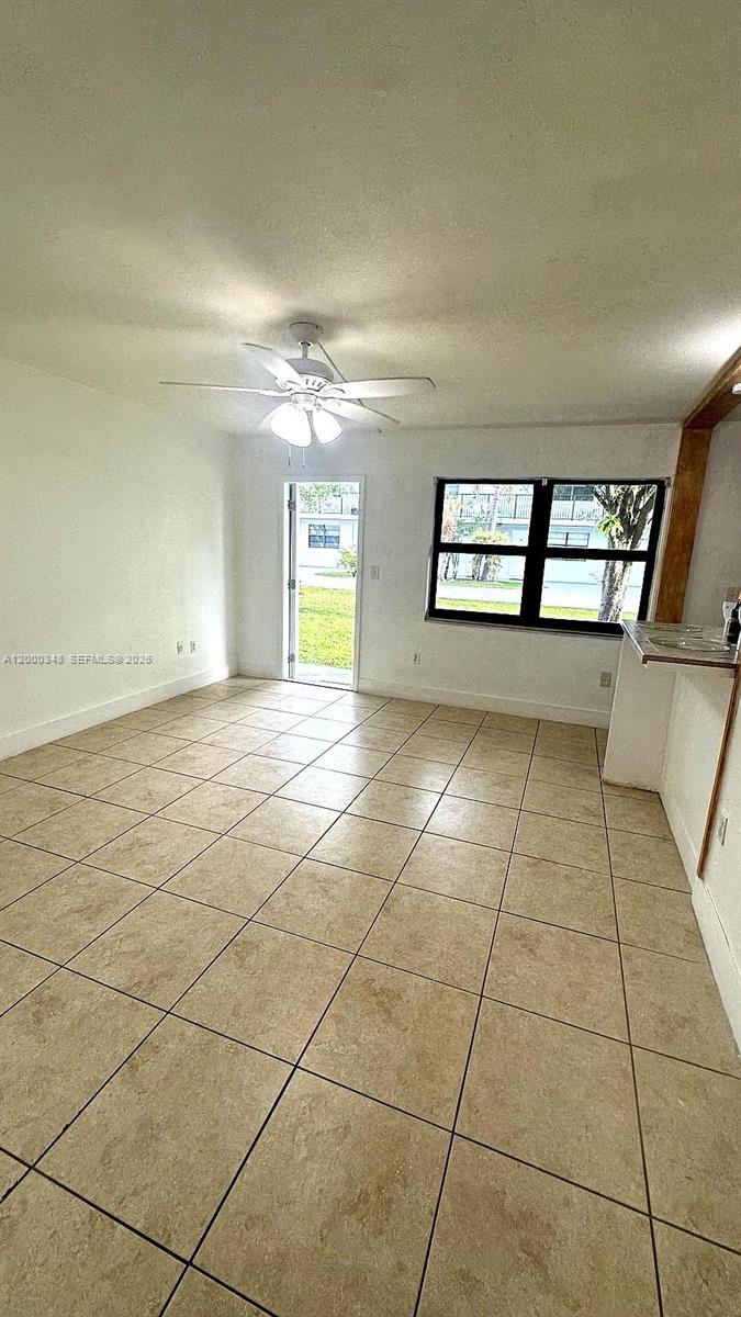 4444 Southwest 67th Avenue, Unit 6 Miami, FL 33155 - Photo 10 of 11 a view of an empty room and window