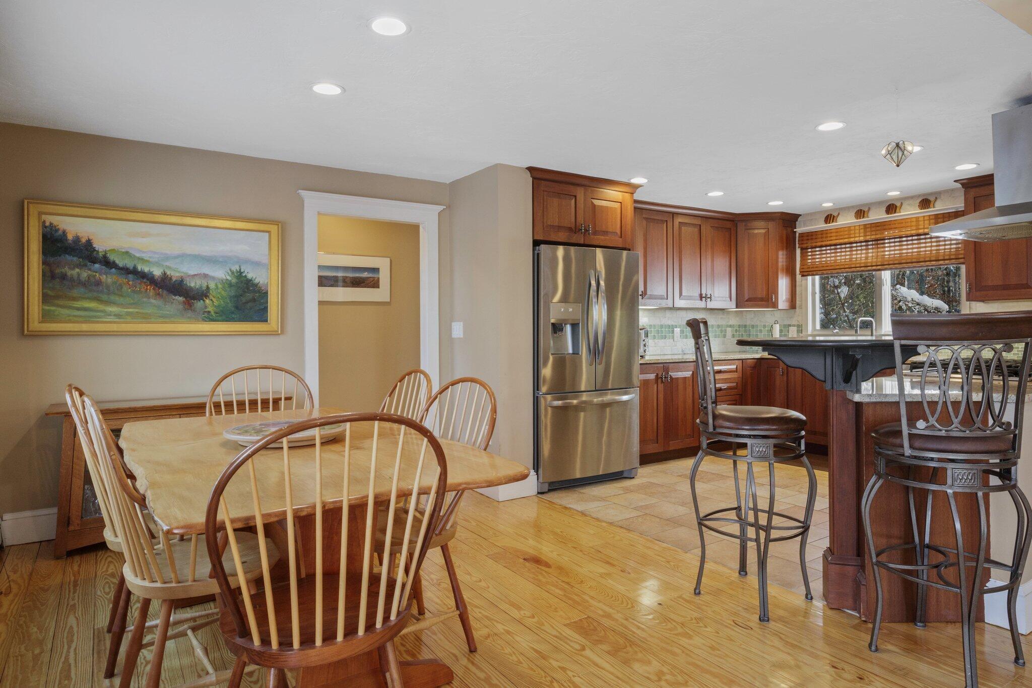 244 Santuit Road Cotuit, MA 02635 - Photo 14 of 58 a dining room with furniture and wooden floor