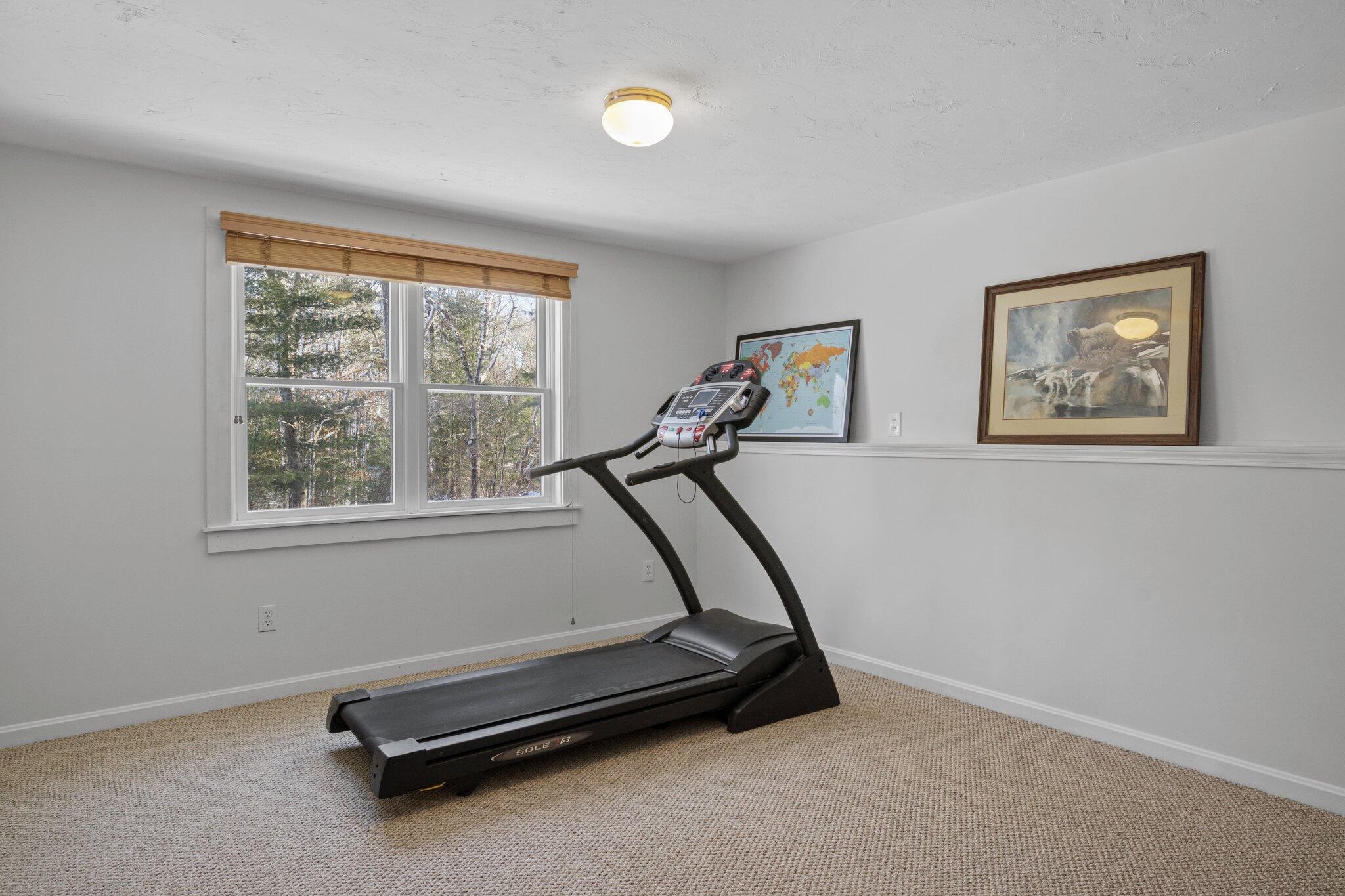 244 Santuit Road Cotuit, MA 02635 - Photo 46 of 58 a room with gym equipment and a window