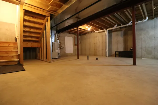 a view of an empty room with a fireplace