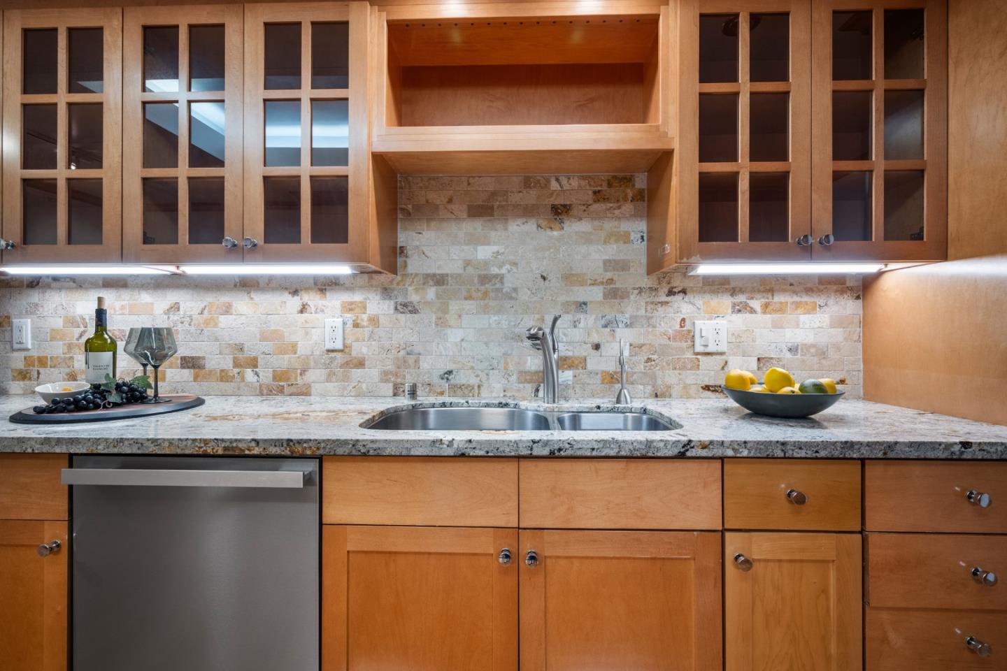 110 Park Road, Unit 103 Burlingame, CA 94010 - Photo 12 of 48 a kitchen with granite countertop stainless steel appliances sink and cabinets