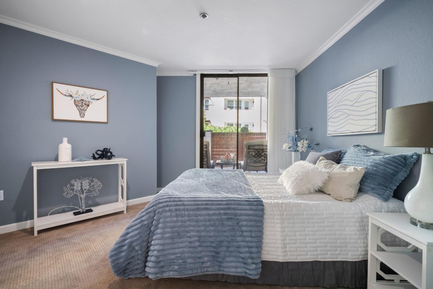 110 Park Road, Unit 103 Burlingame, CA 94010 - Photo 21 of 48 a bedroom with a bed and a window