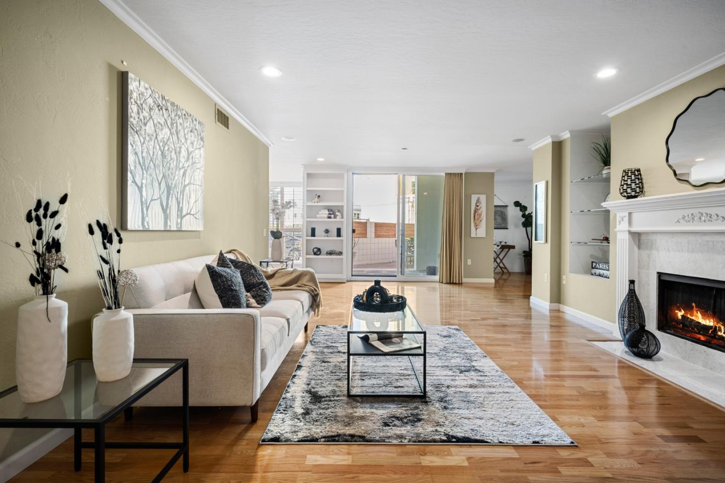 110 Park Road, Unit 103 Burlingame, CA 94010 - Photo 5 of 48 a living room with furniture and a fireplace