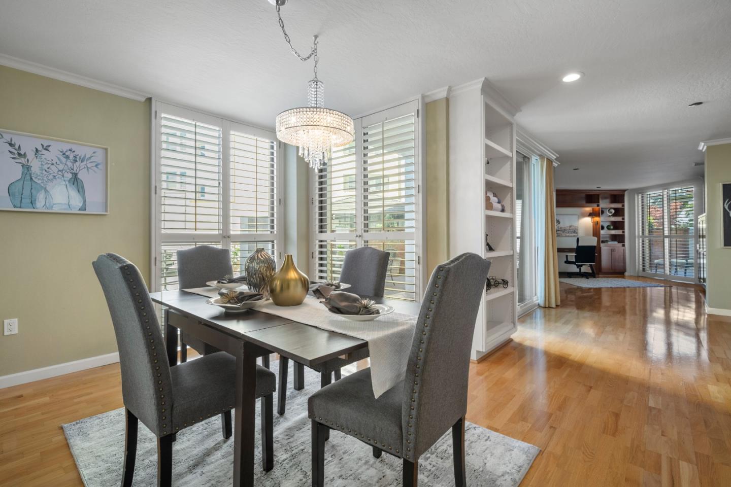 110 Park Road, Unit 103 Burlingame, CA 94010 - Photo 8 of 48 a view of a dining room with furniture window and wooden floor