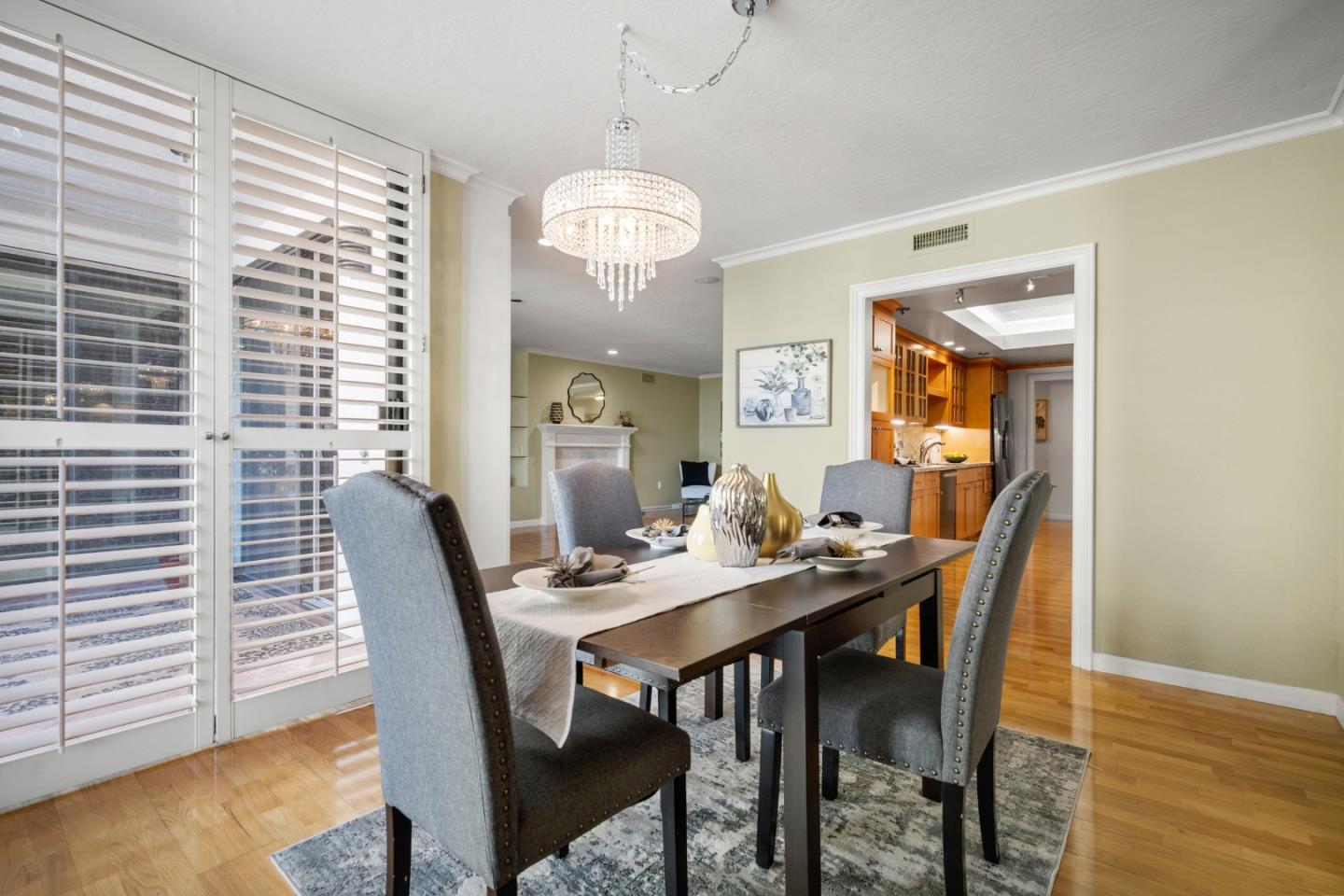 110 Park Road, Unit 103 Burlingame, CA 94010 - Photo 10 of 48 a view of a dining room with furniture and wooden floor