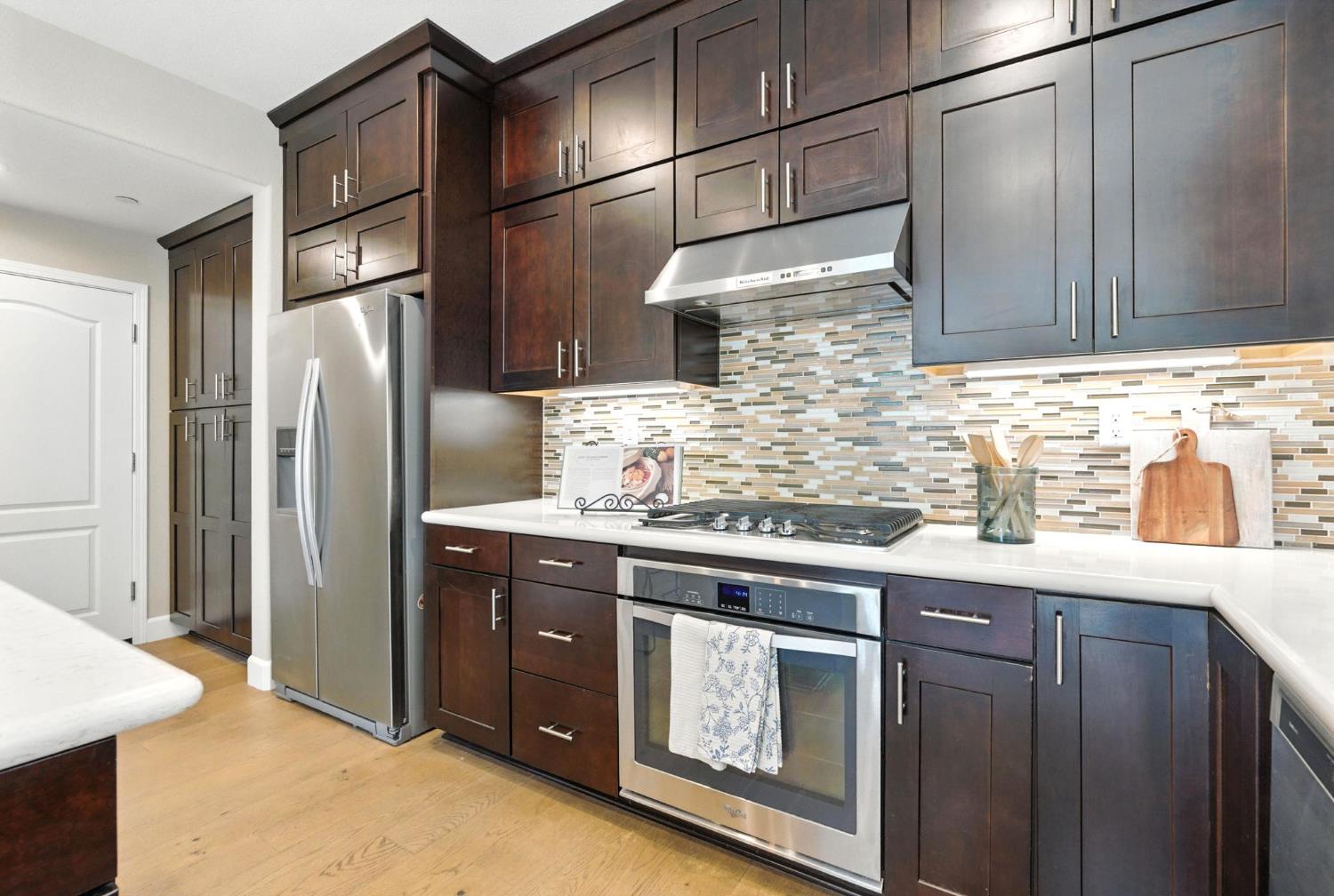 2248 Cannery Loop Davis, CA 95616 - Photo 11 of 34 a kitchen with stainless steel appliances granite countertop a refrigerator and a sink