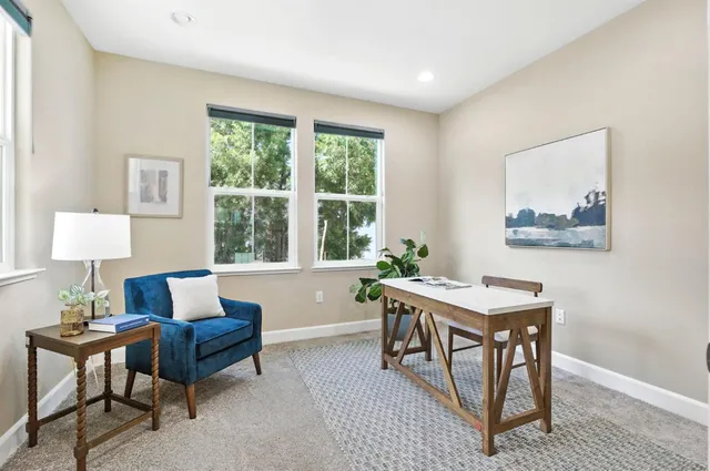 a workspace with furniture and a window