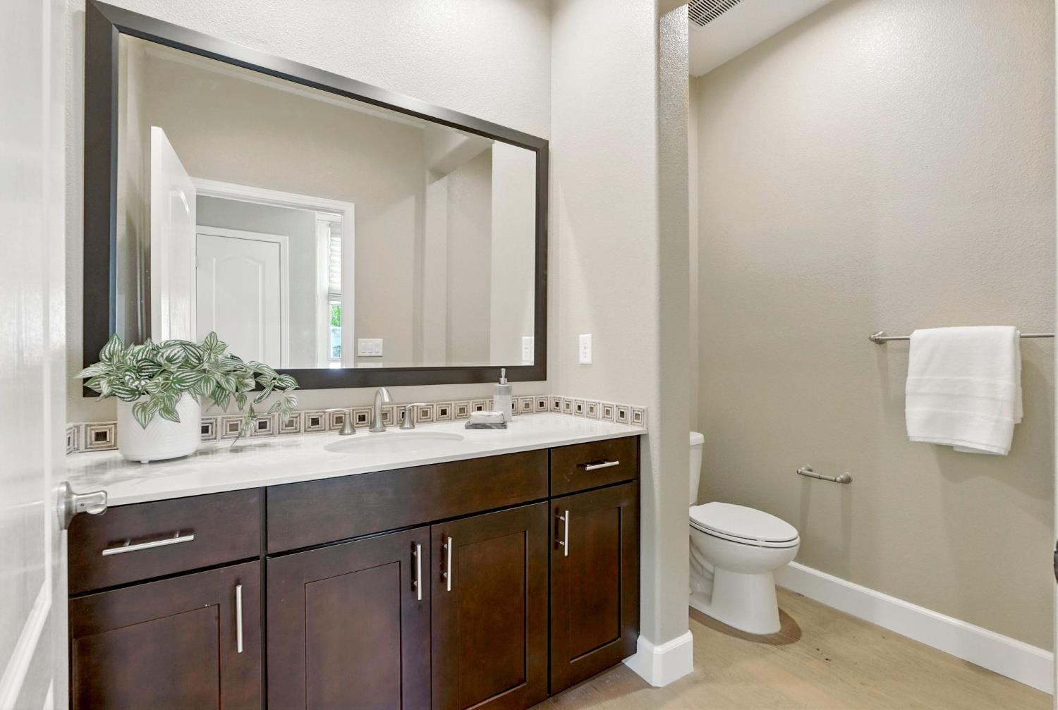 2248 Cannery Loop Davis, CA 95616 - Photo 13 of 34 a bathroom with a toilet sink and mirror