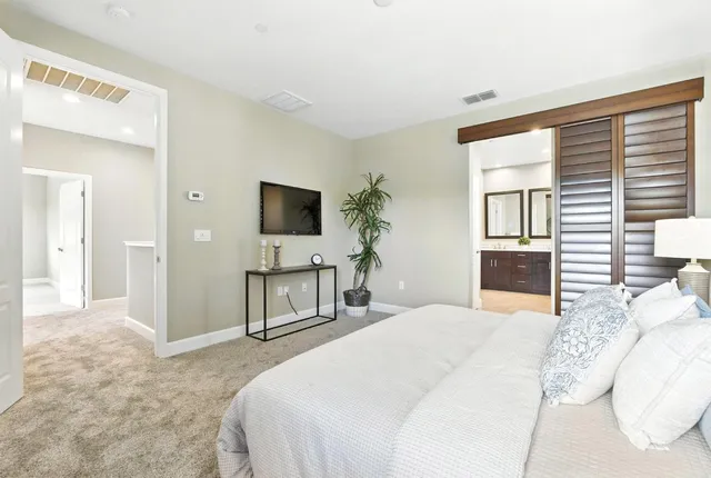 a bathroom with a tub a sink and a mirror