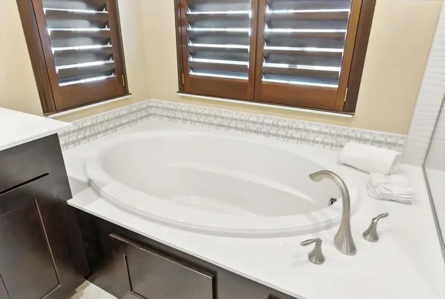 a bathroom with a bathtub and a sink