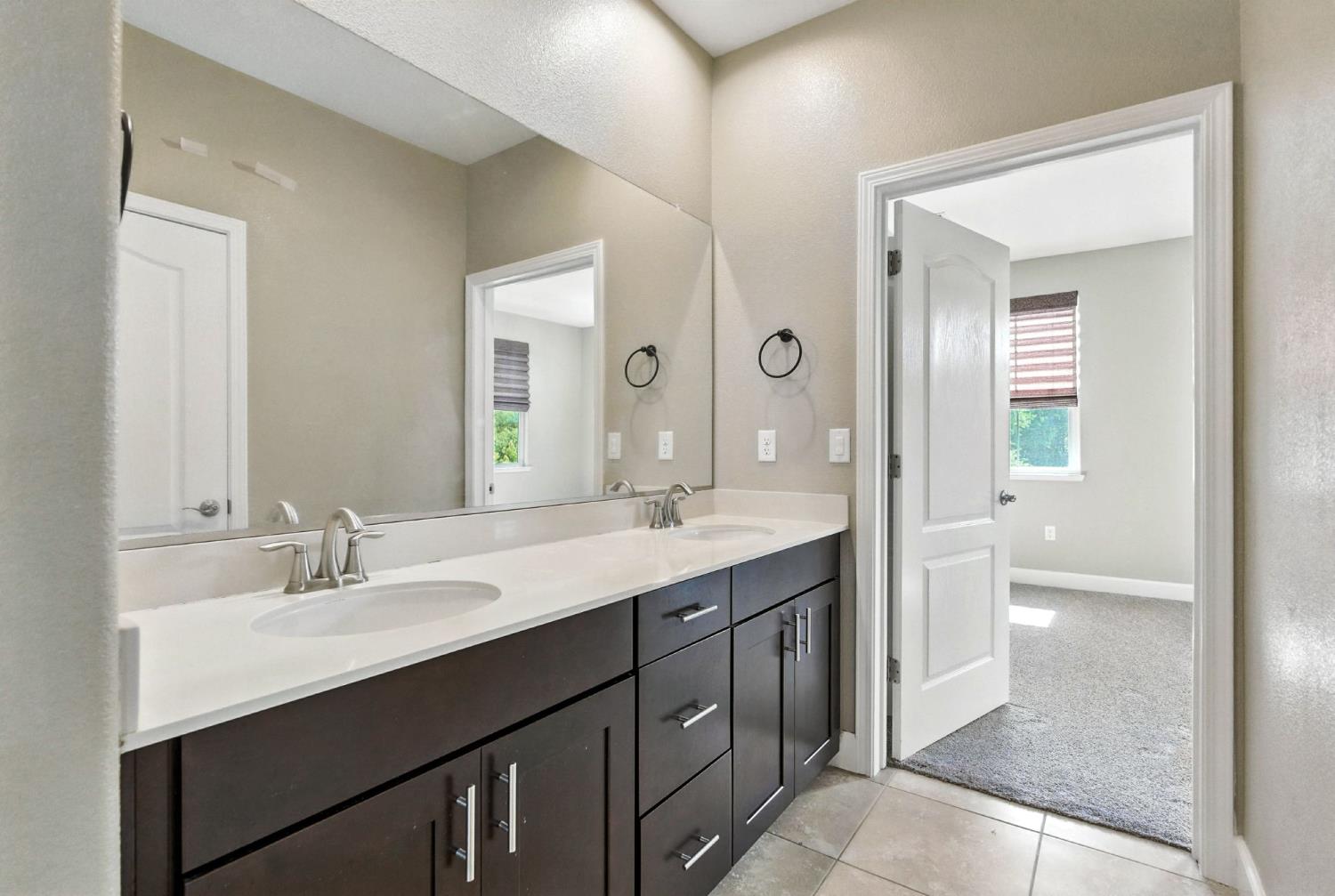 2248 Cannery Loop Davis, CA 95616 - Photo 27 of 34 a bathroom with a sink a toilet a shower and a mirror