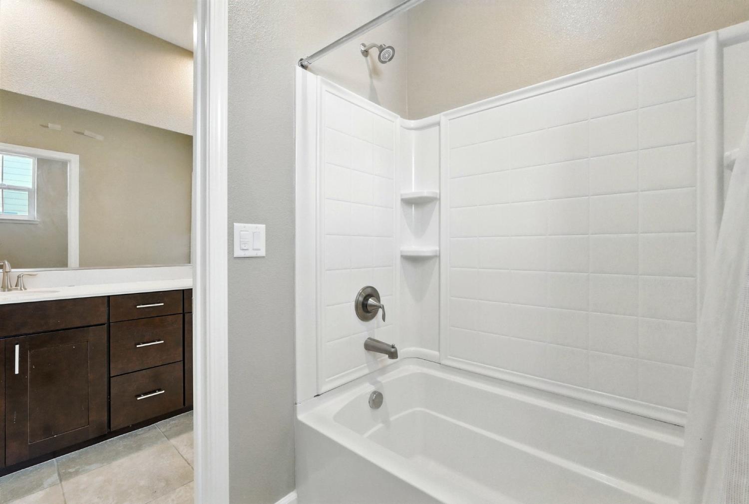 2248 Cannery Loop Davis, CA 95616 - Photo 28 of 34 a bathroom with a bathtub and a sink