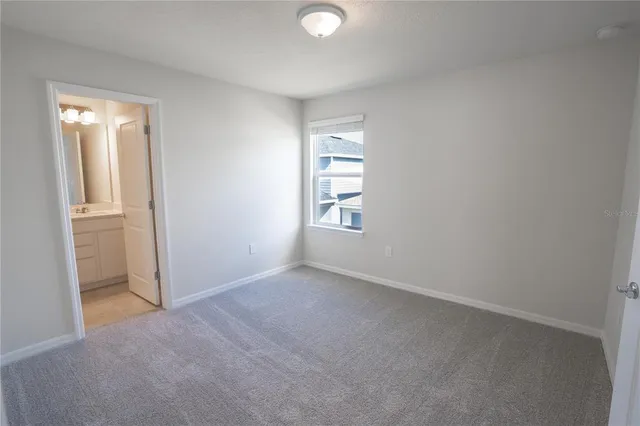 a bathroom with a toilet a sink and bathtub