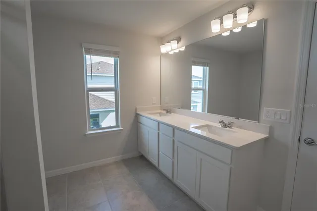 a bathroom with a bathtub and a sink