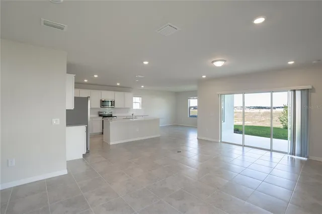 a view of a kitchen and window