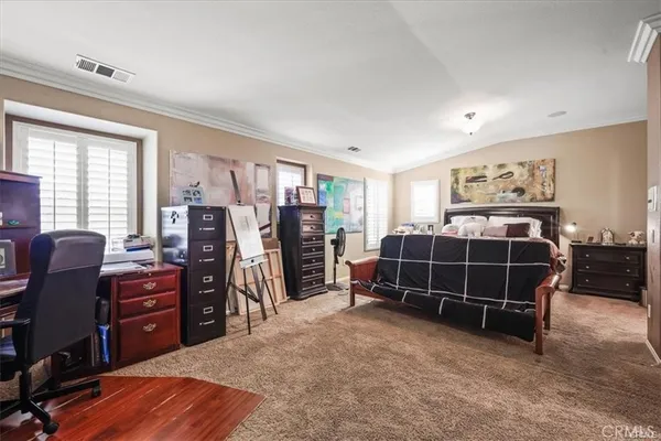 a bedroom with a bed and a closet