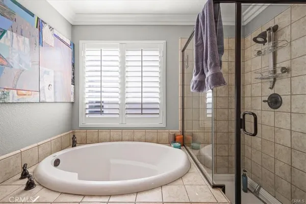 a bathroom with a tub and window