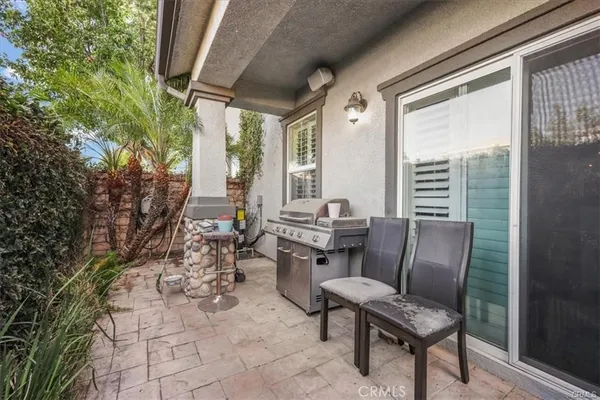 a balcony with chairs and with outdoor seating