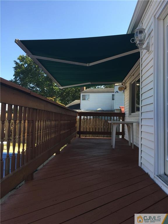 33 Back Drive Edison, NJ 08817 - Photo 13 of 25 a balcony with wooden floor