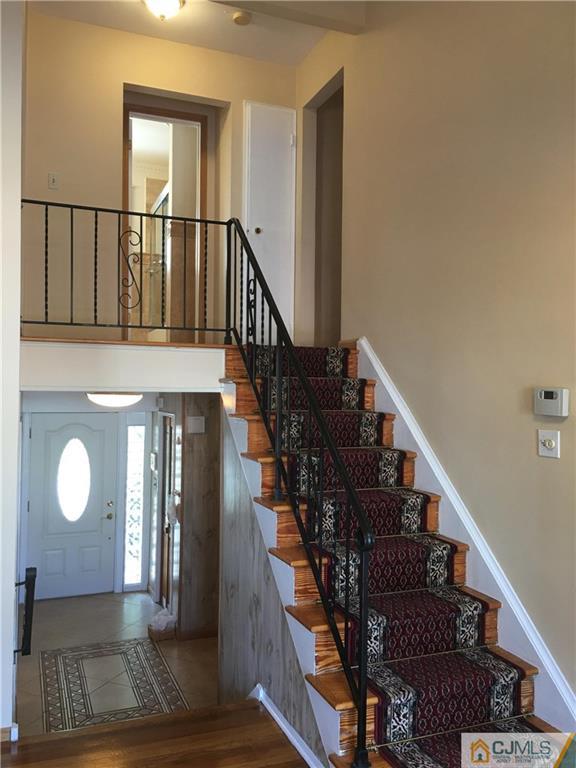 33 Back Drive Edison, NJ 08817 - Photo 14 of 25 a view of entryway and hall with wooden floor