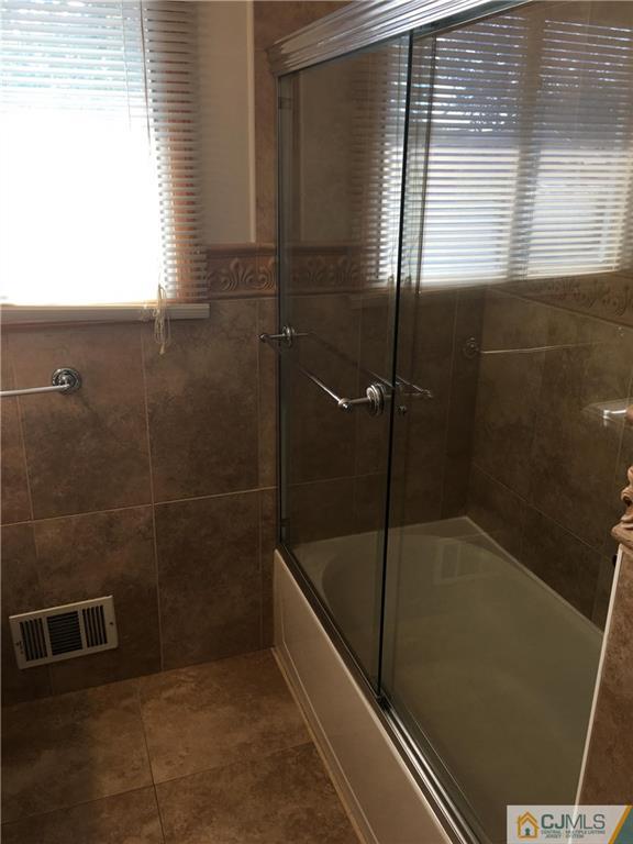 33 Back Drive Edison, NJ 08817 - Photo 17 of 25 a bathroom with a shower