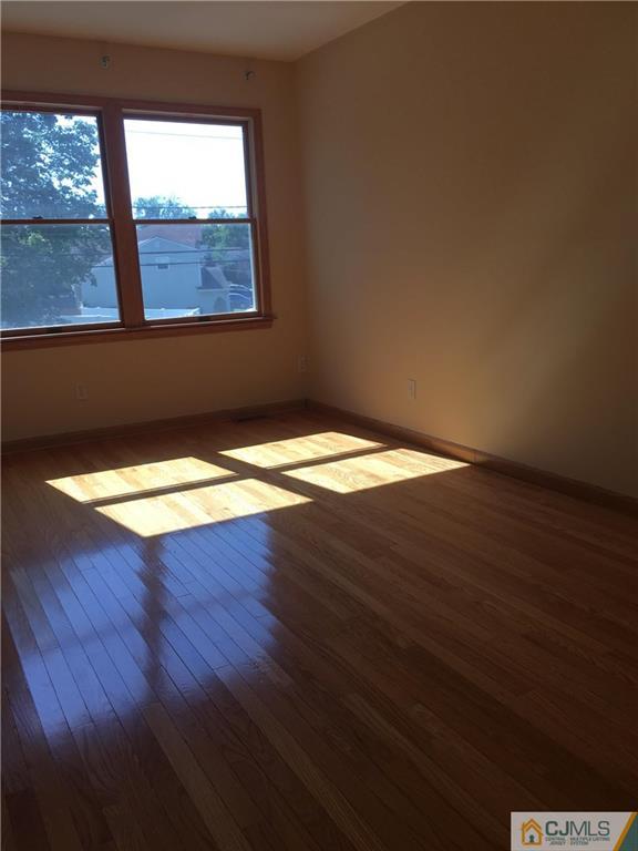 33 Back Drive Edison, NJ 08817 - Photo 18 of 25 a view of wooden floor and brick walls
