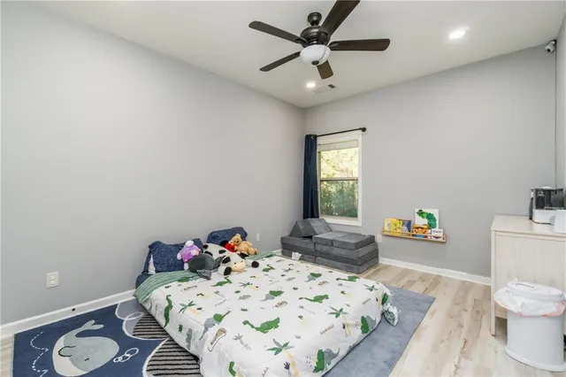 a bedroom with a bed and furniture