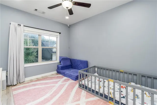 a bedroom with furniture and a window