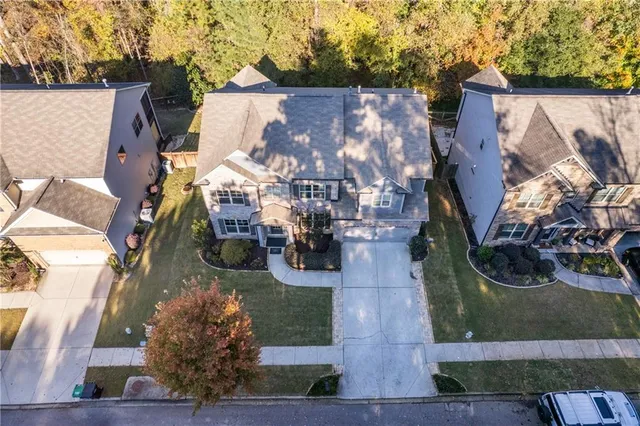 an aerial view of a house with outdoor space