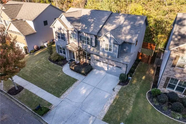 a view of multiple houses with a yard