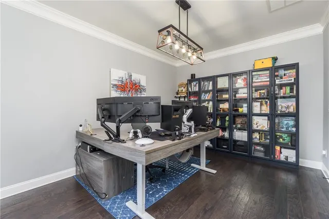 a work room with furniture and a chandelier