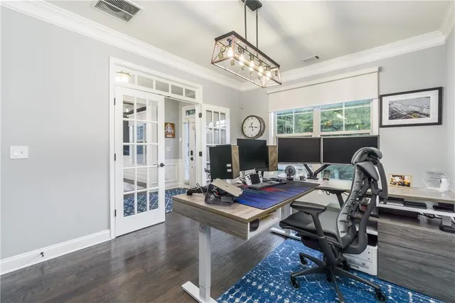 a work room with furniture and wooden floor