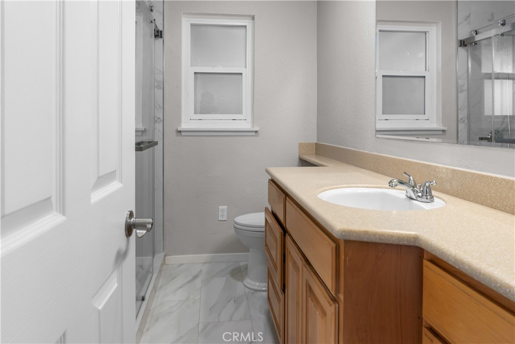 18811 East Weather Road Covina, CA 91722 - Photo 9 of 20 a bathroom with a sink toilet and vanity