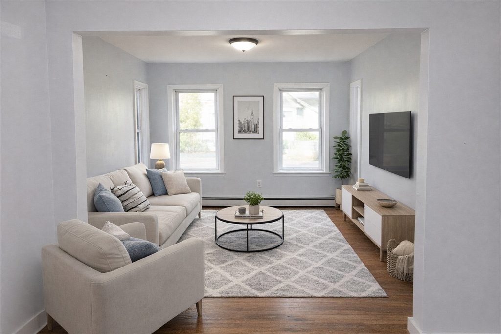 958 Center Street Middleboro, MA 02346 - Photo 7 of 17 a living room with furniture a flat screen tv and a window