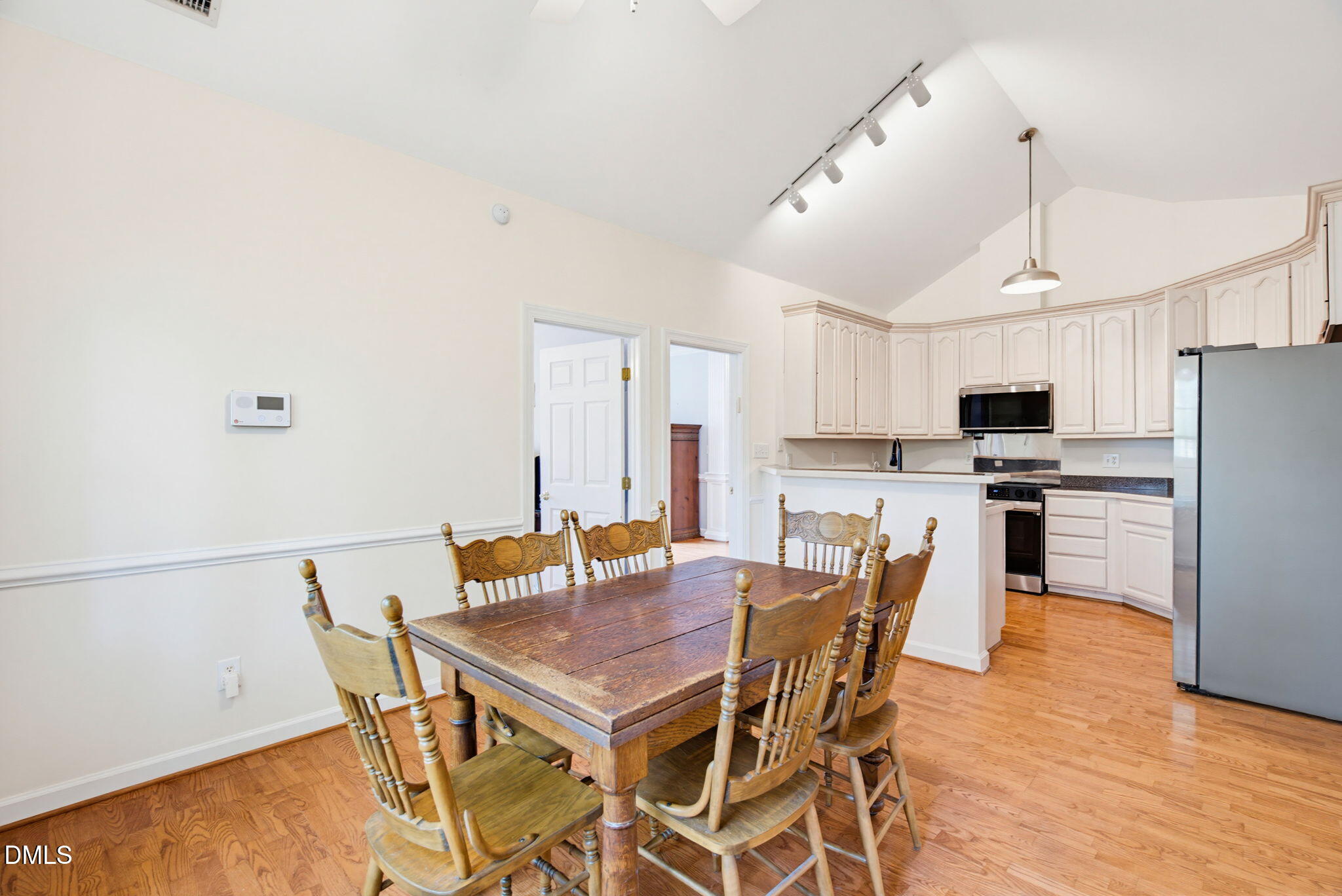 2533 Big Sky Lane Raleigh, NC 27615 - Photo 14 of 40 a view of a dining room with furniture and wooden floor