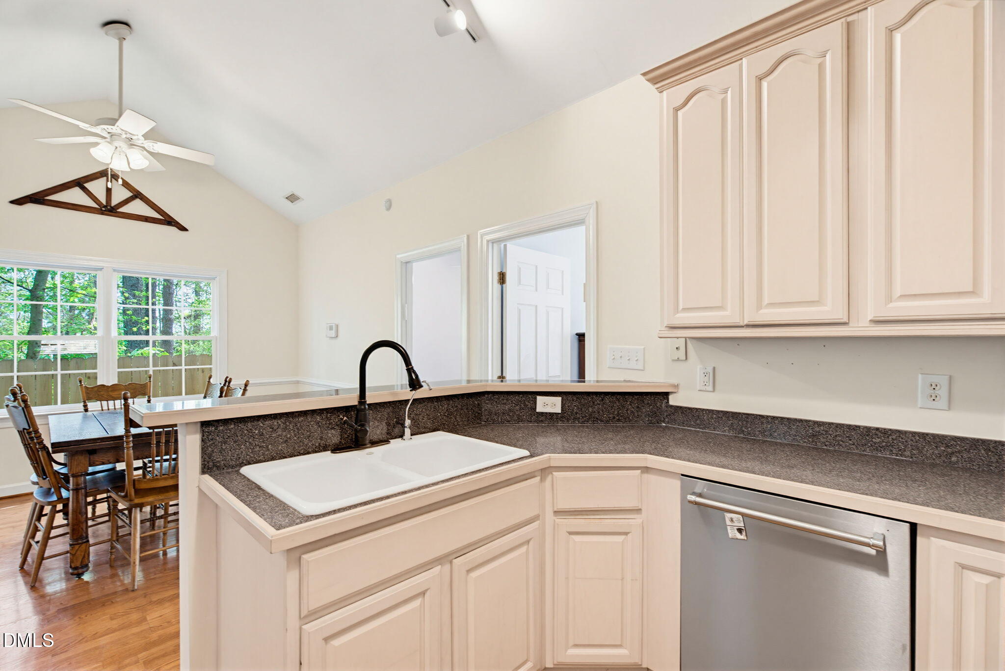 2533 Big Sky Lane Raleigh, NC 27615 - Photo 17 of 40 a kitchen with a sink cabinets and window