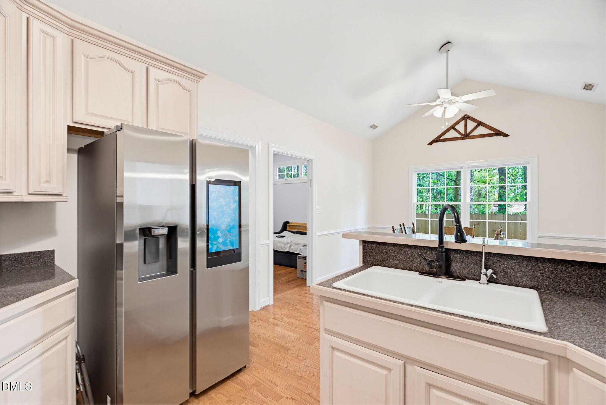 2533 Big Sky Lane Raleigh, NC 27615 - Photo 18 of 40 a kitchen with a refrigerator and a sink