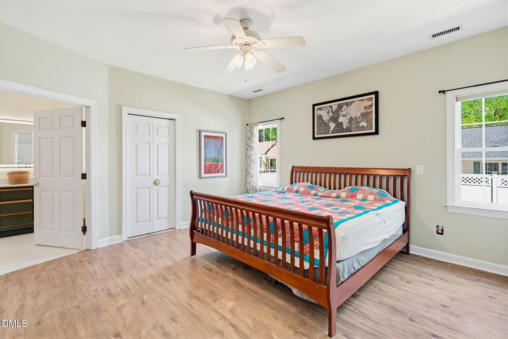 2533 Big Sky Lane Raleigh, NC 27615 - Photo 19 of 40 a bedroom with a bed and a chandelier