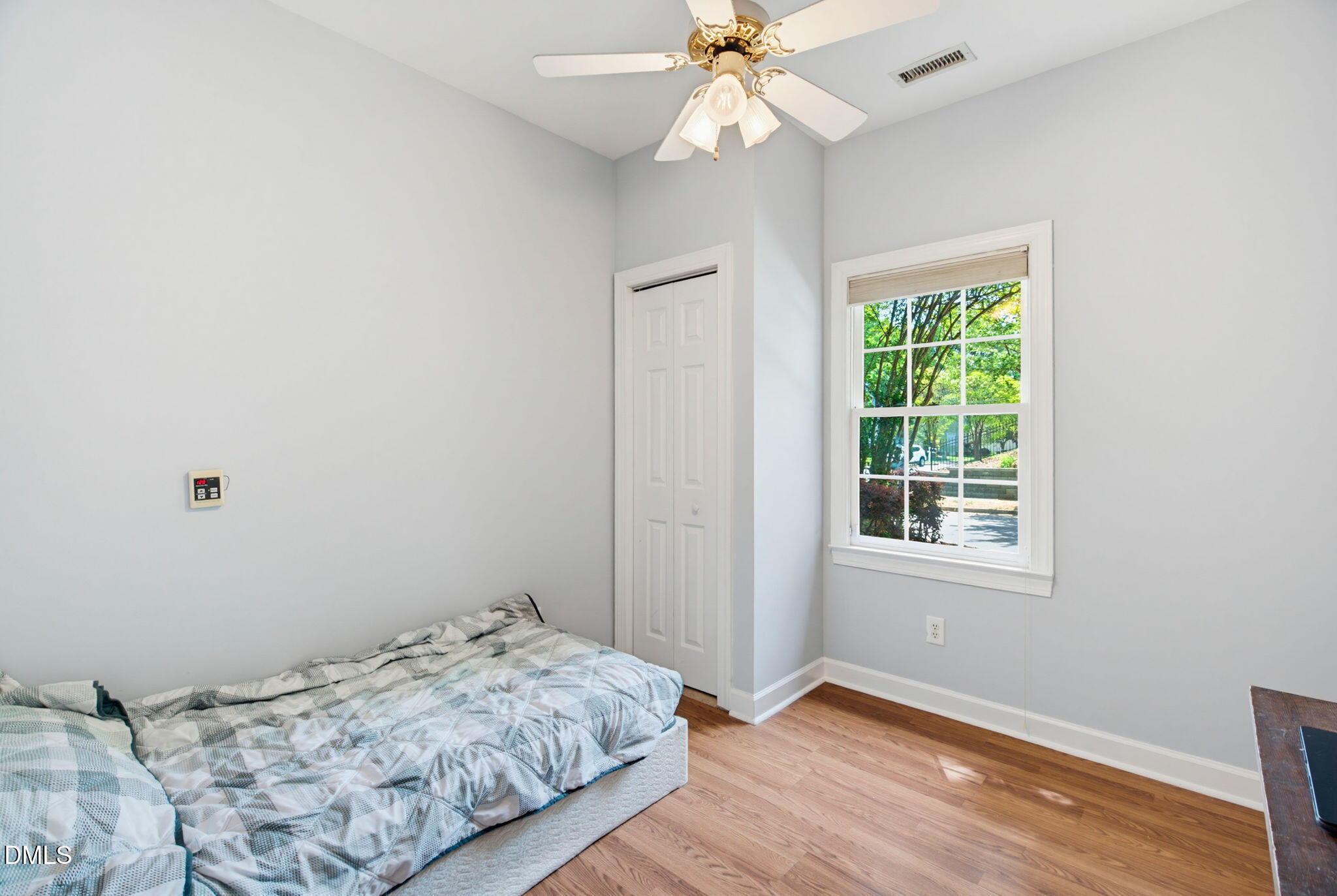 2533 Big Sky Lane Raleigh, NC 27615 - Photo 23 of 40 a bedroom with a bed and wooden floor