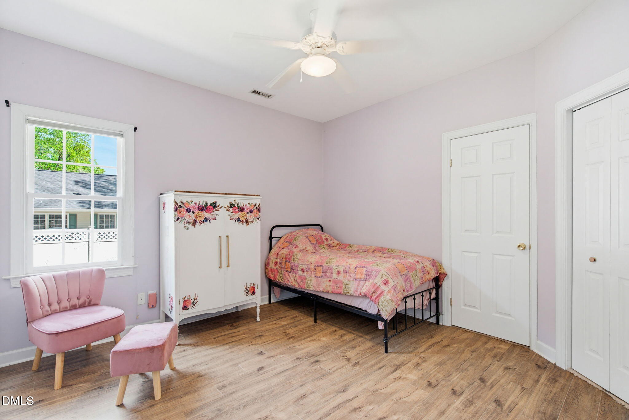 2533 Big Sky Lane Raleigh, NC 27615 - Photo 24 of 40 a bedroom with a bed and a chair