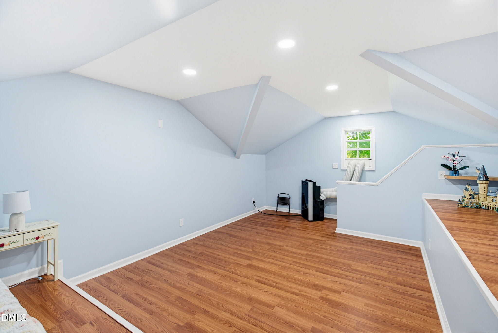 2533 Big Sky Lane Raleigh, NC 27615 - Photo 28 of 40 a room with a bed and wooden floor