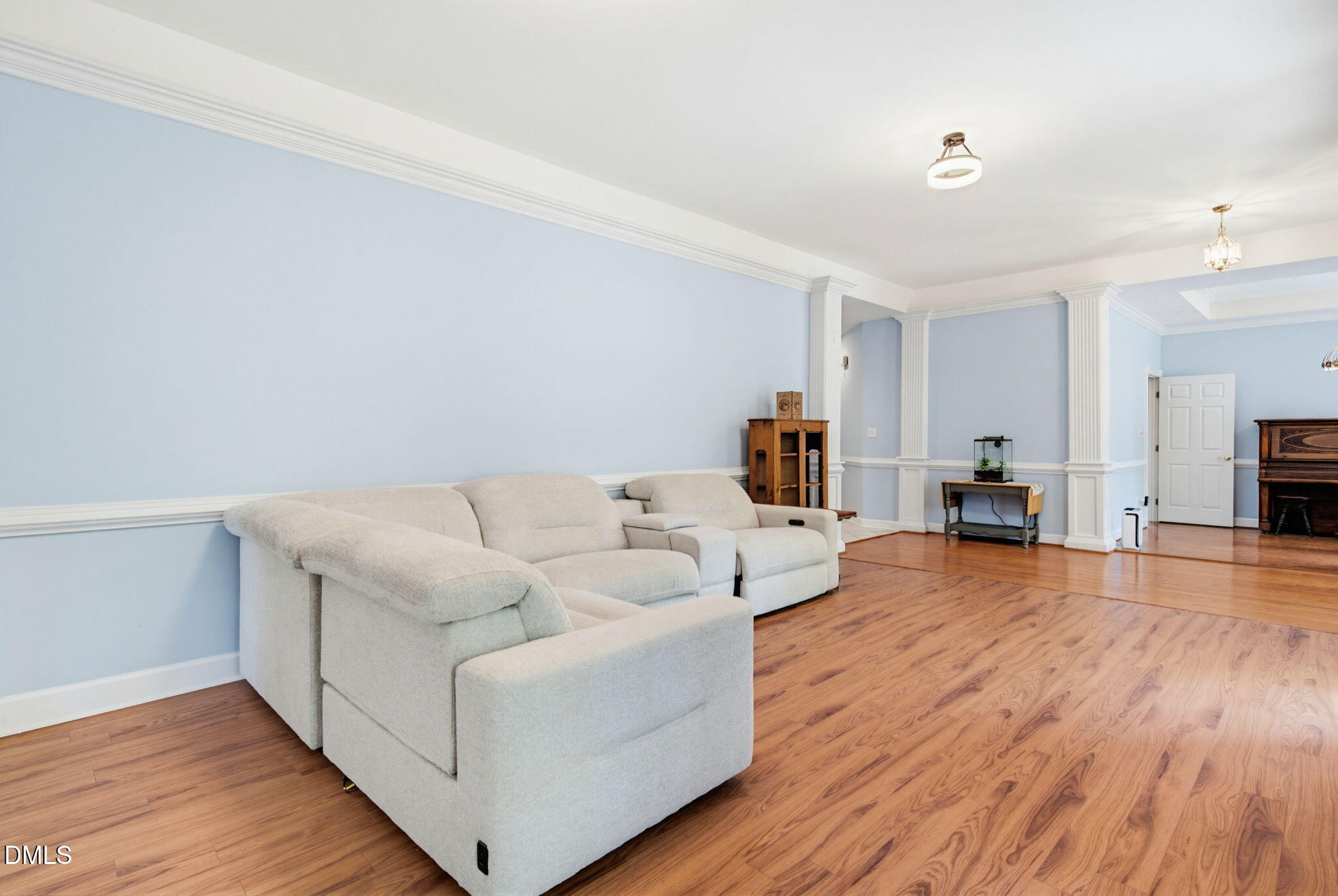 2533 Big Sky Lane Raleigh, NC 27615 - Photo 7 of 40 a living room with furniture and a wooden floor