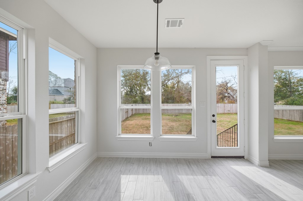 16511 Boston Post Road Cypress, TX 77429 - Photo 16 of 46 a view of room with window and hardwood floor