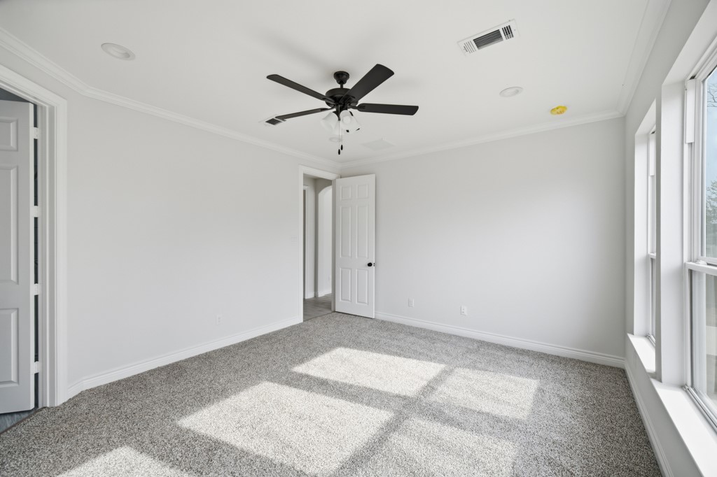 16511 Boston Post Road Cypress, TX 77429 - Photo 20 of 46 a view of a room with a ceiling fan and window