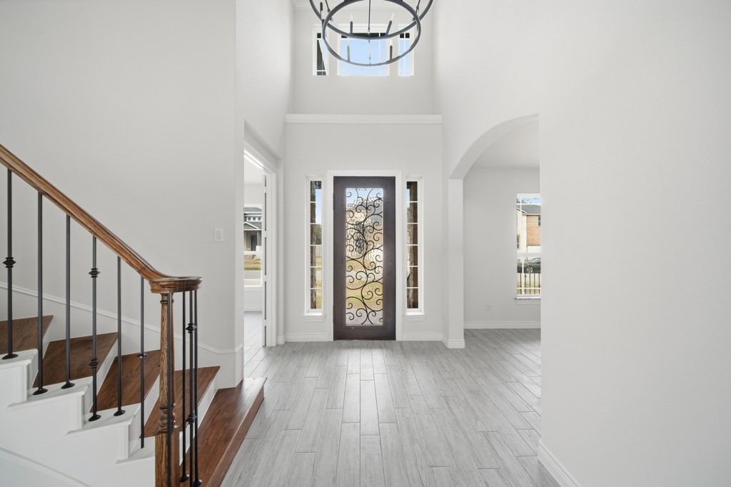 16511 Boston Post Road Cypress, TX 77429 - Photo 3 of 46 a view of a hallway with wooden floor and windows